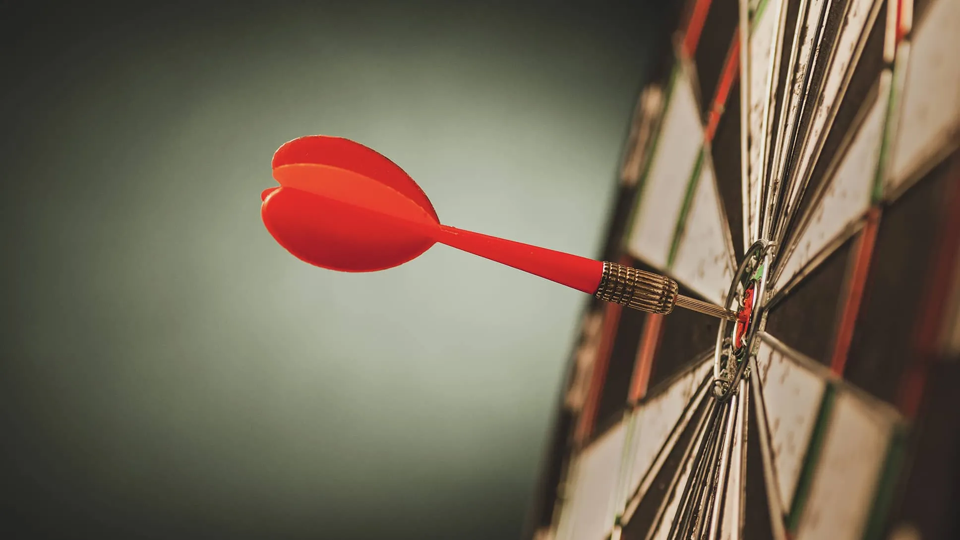 Dartboard with red dart