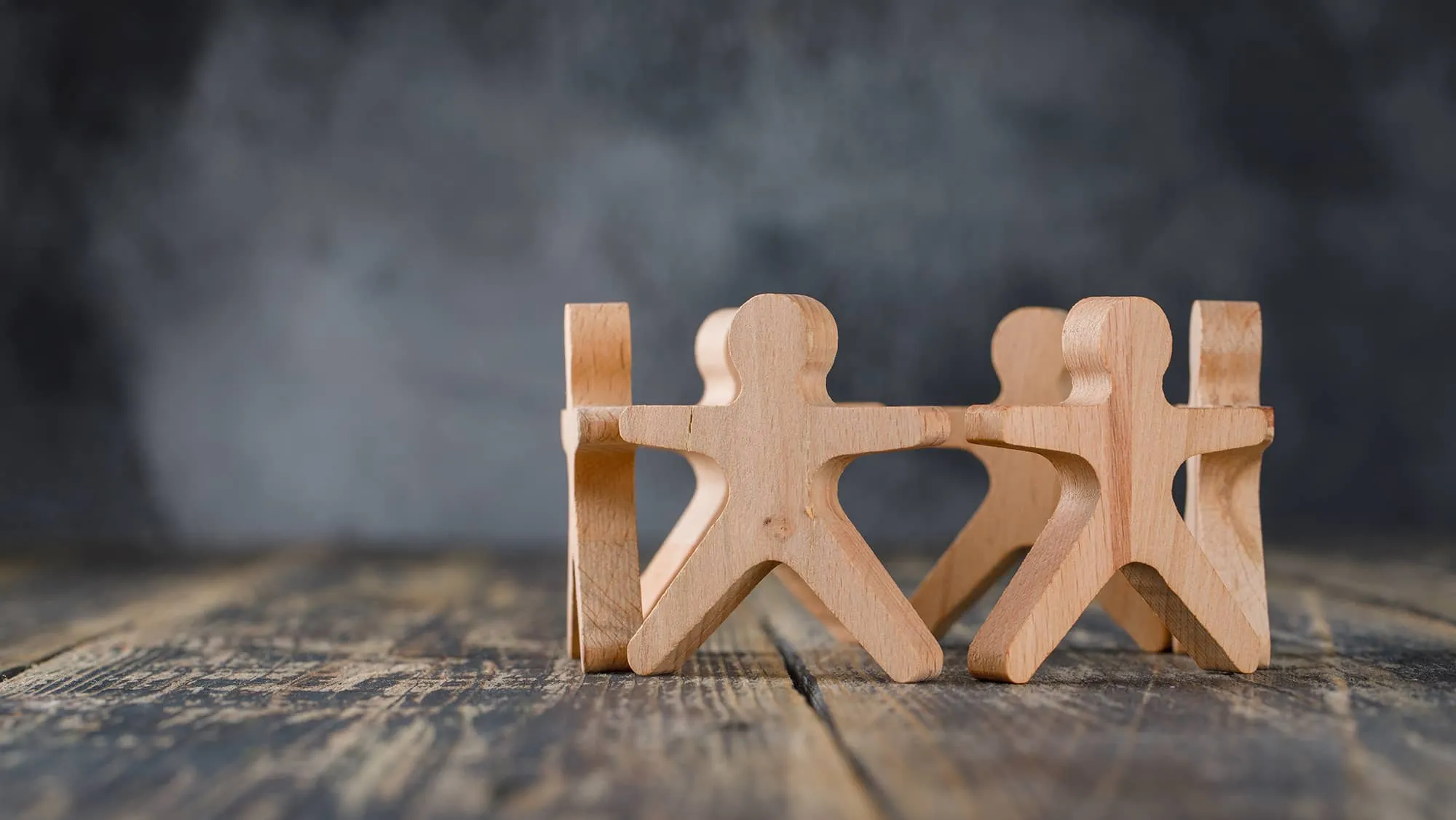 Wooden figures represents the connections between employees.
