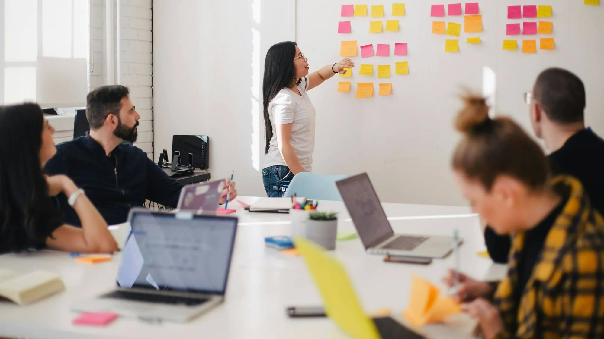 A group brainstorming at a board